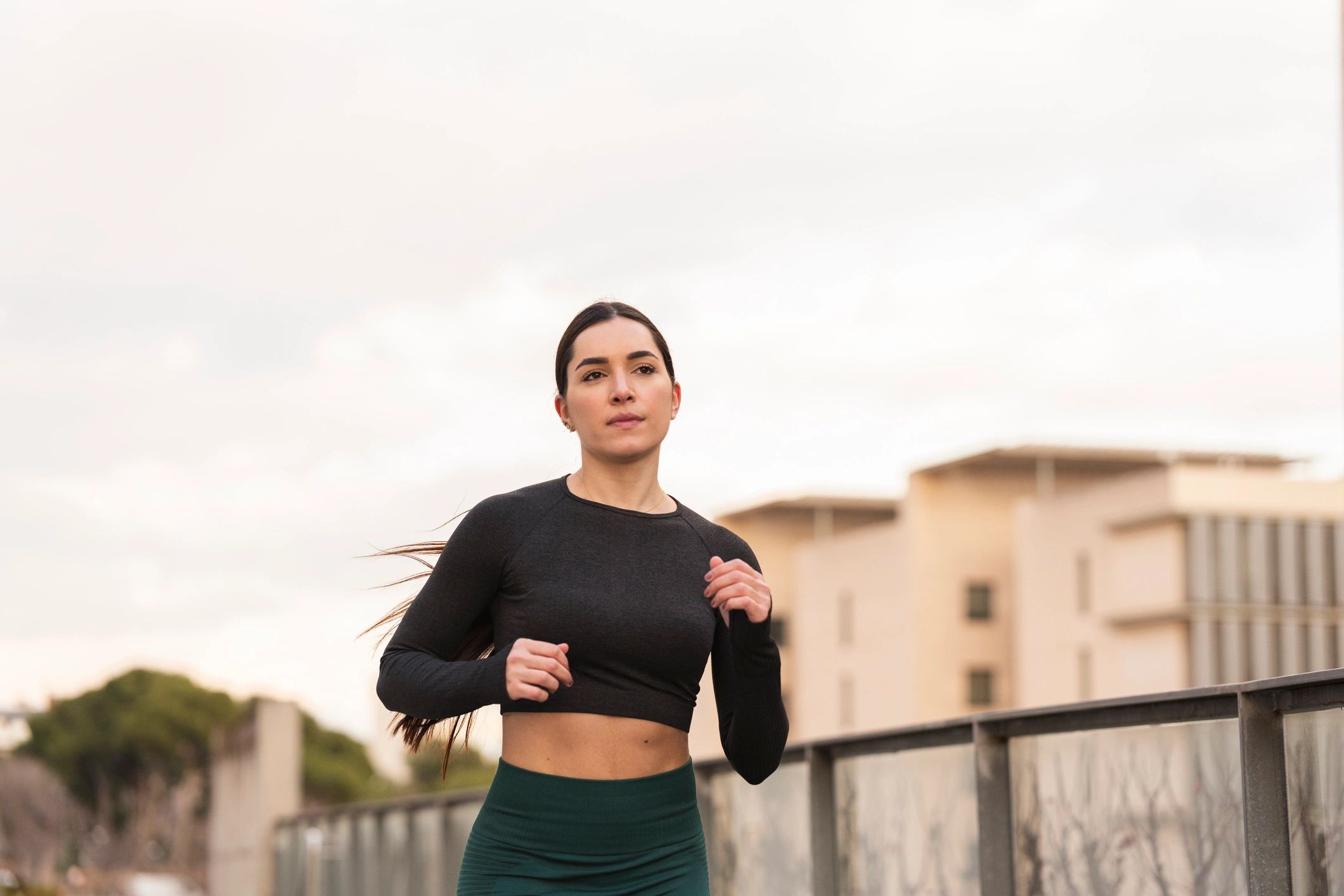 Woman running outdoors during training