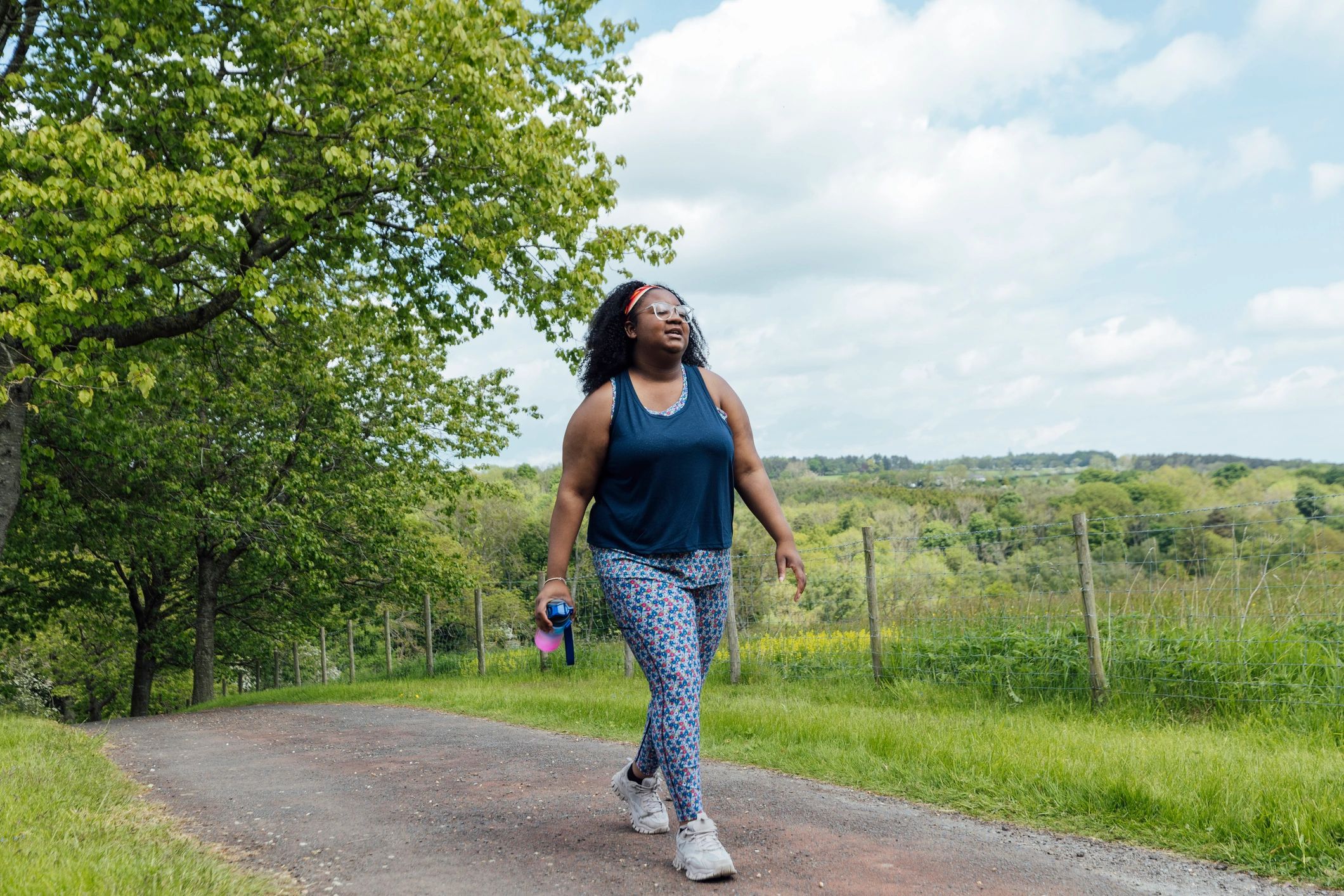Woman walking for exercise in a park